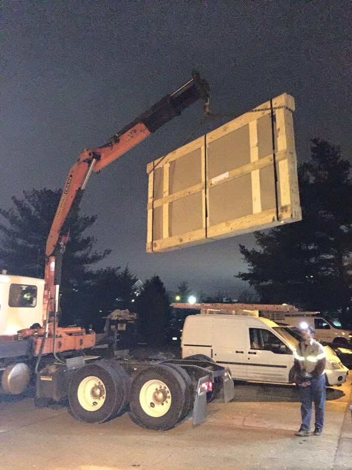 Glass delivery by crane before daylight