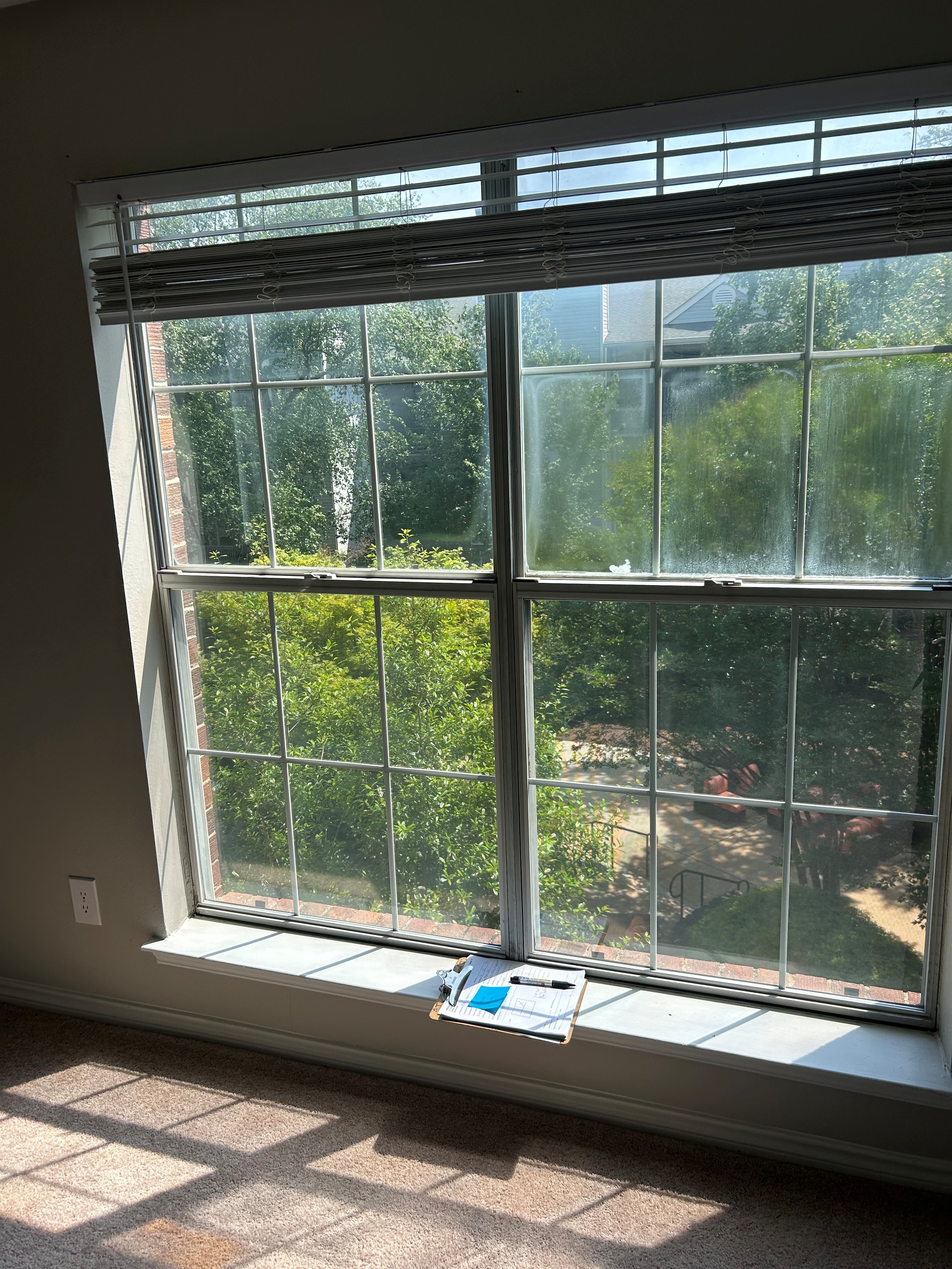 Clouding and white residue in the upper-right divided-light window unit