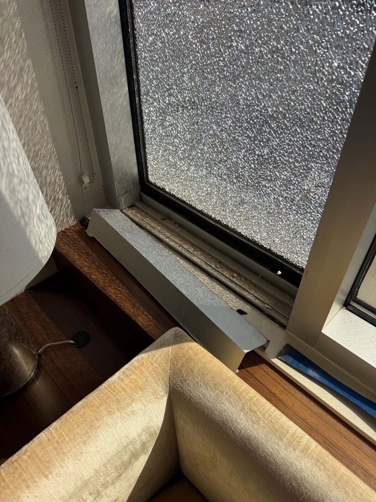 A window pane with an extensive shattered-glass pattern