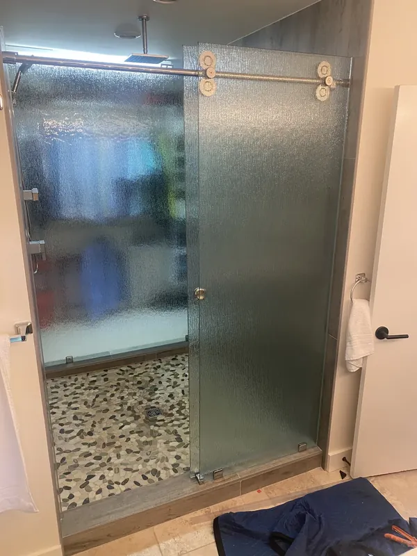 Textured sliding shower doors.