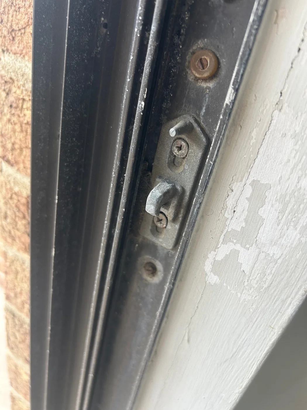 A close-up shows latch hardware within a sliding door frame.
