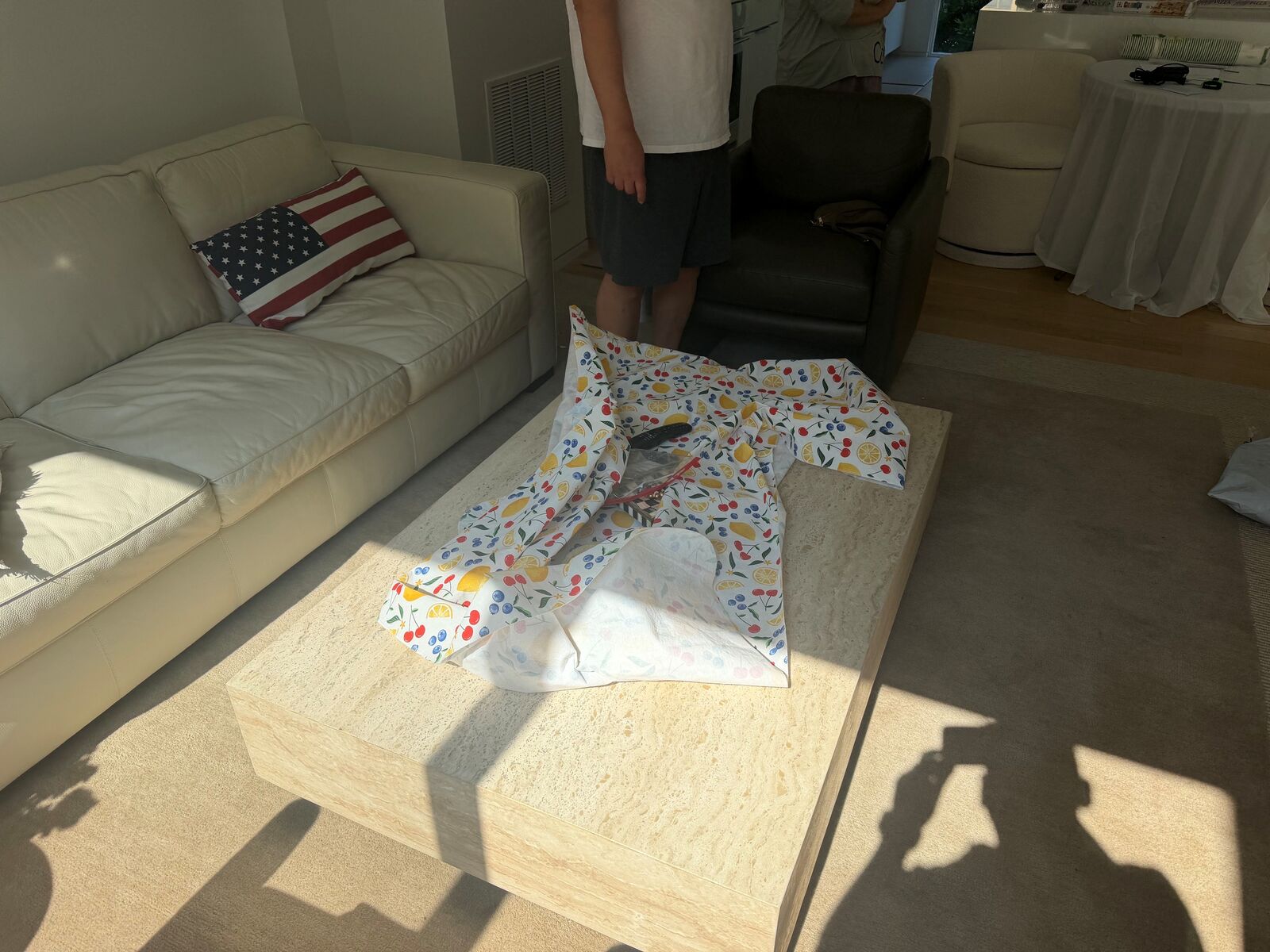 A paper template laid on a coffee table to size a glass top