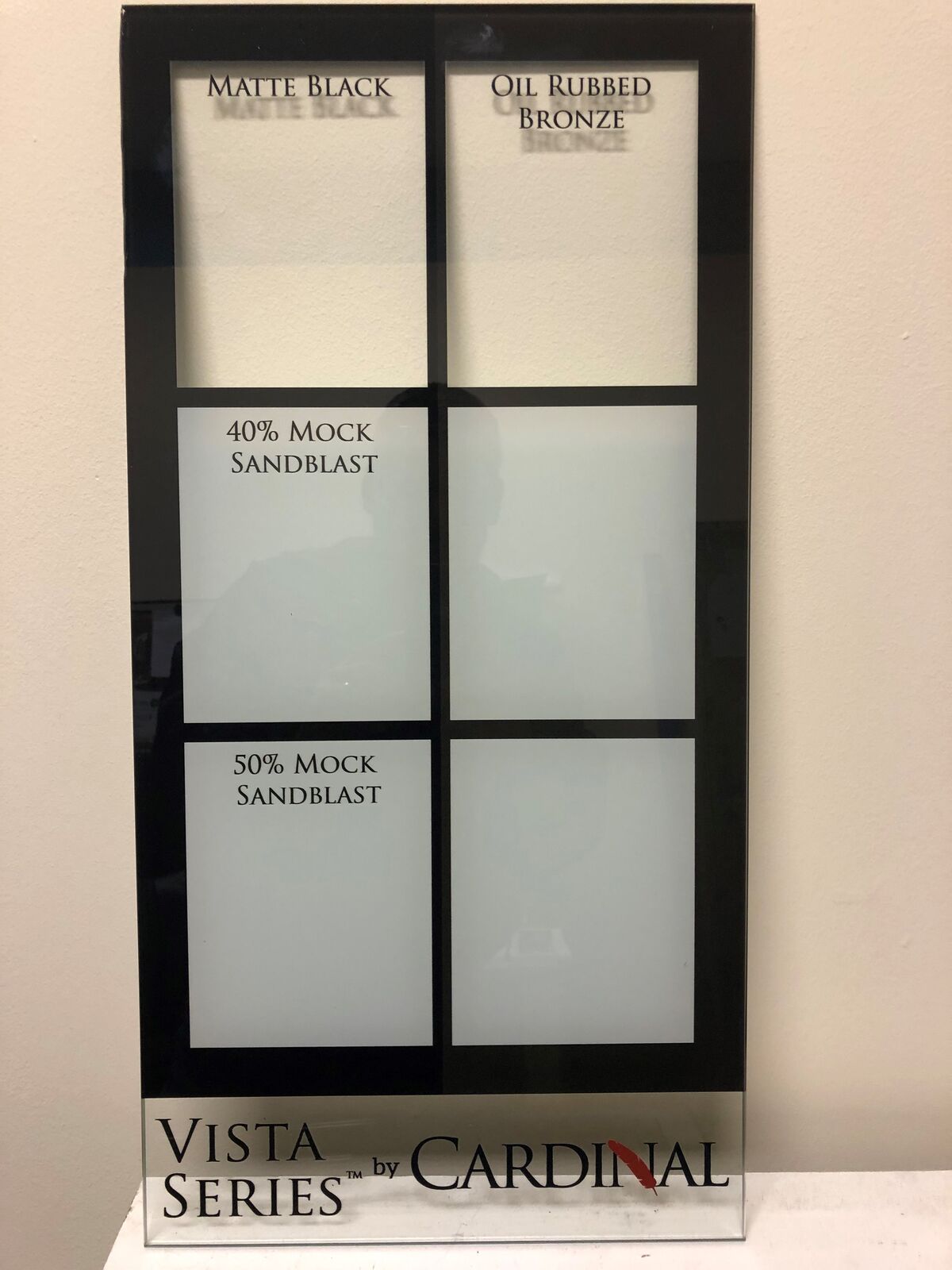 A display of decorative and privacy glass samples
