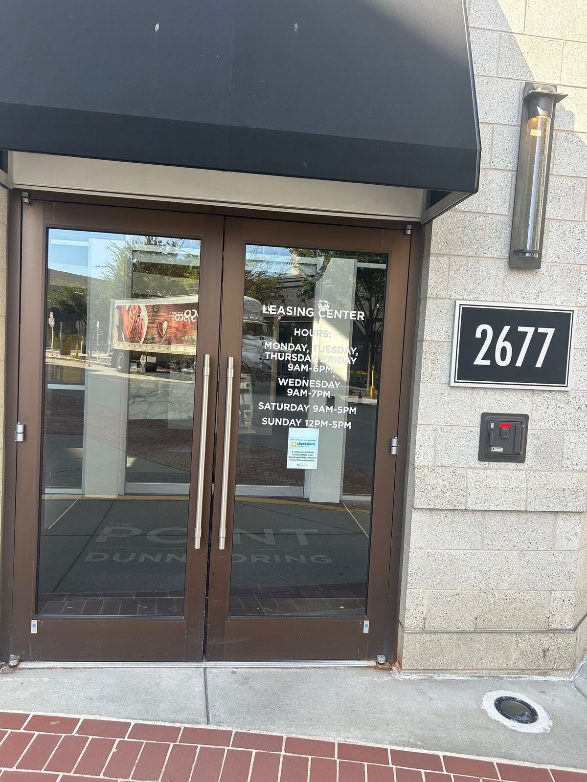 Dark-framed double glass doors at a commercial entrance